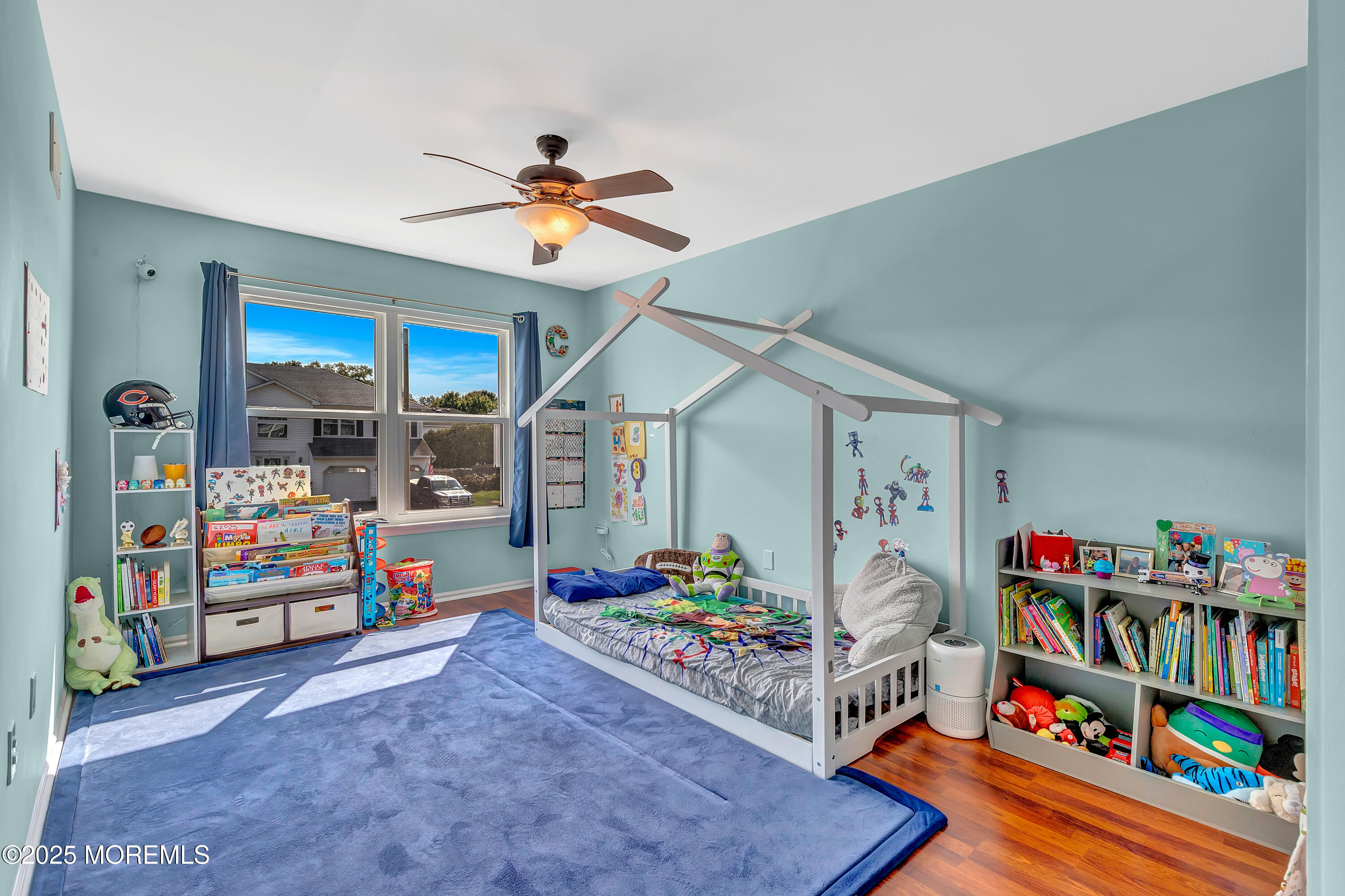 66 Diamond Lane Howell, NJ 07731 - Photo 30 of 47 a bed room with a bed and a book shelf