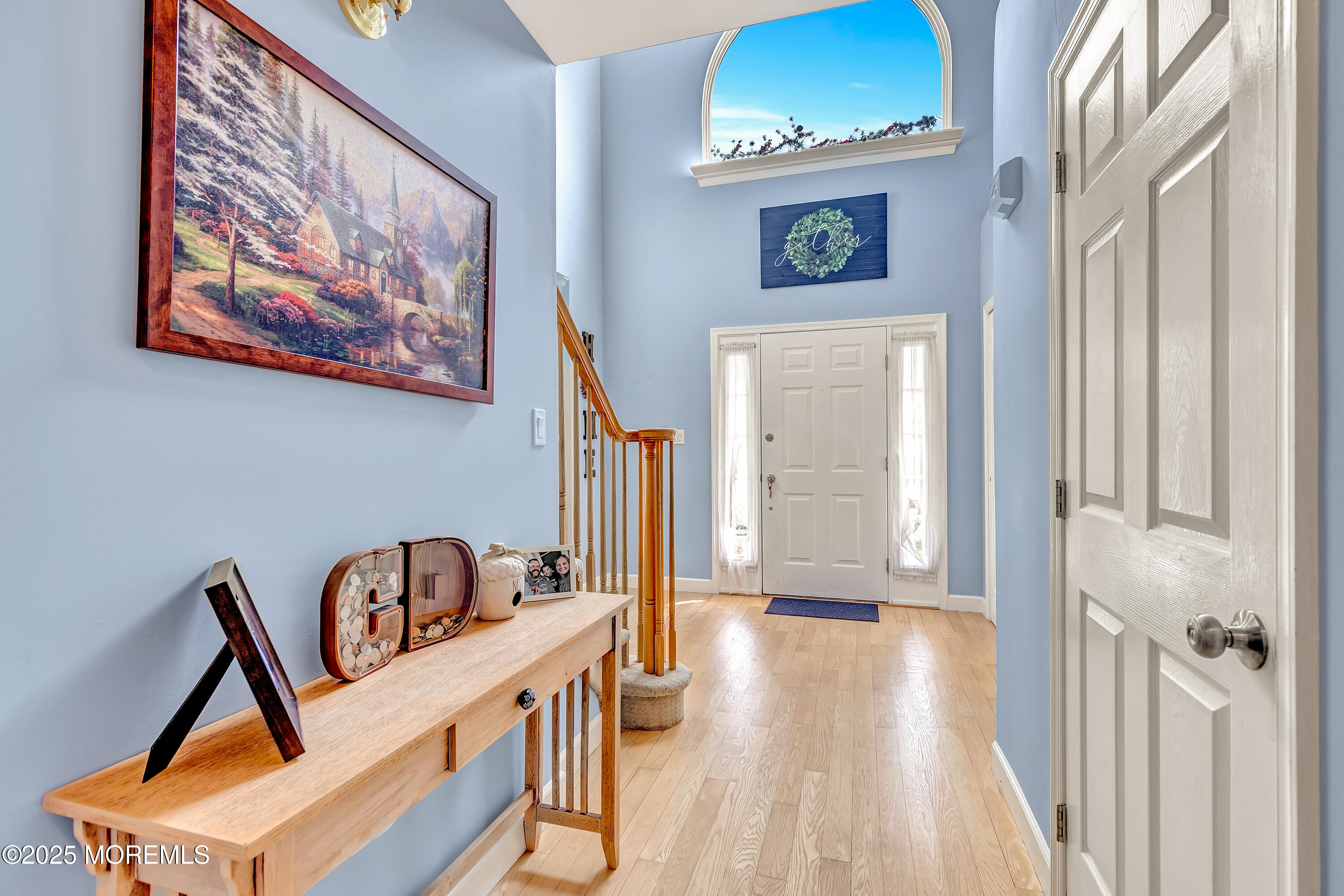 66 Diamond Lane Howell, NJ 07731 - Photo 4 of 47 a view of a hallway with wooden floor and a workspace