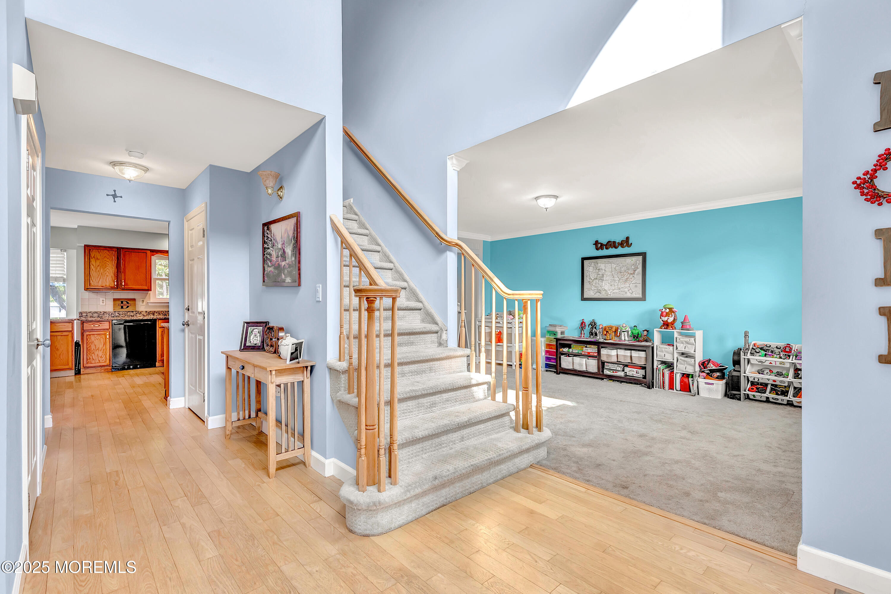 66 Diamond Lane Howell, NJ 07731 - Photo 5 of 47 a view of a livingroom with wooden floor and stairs