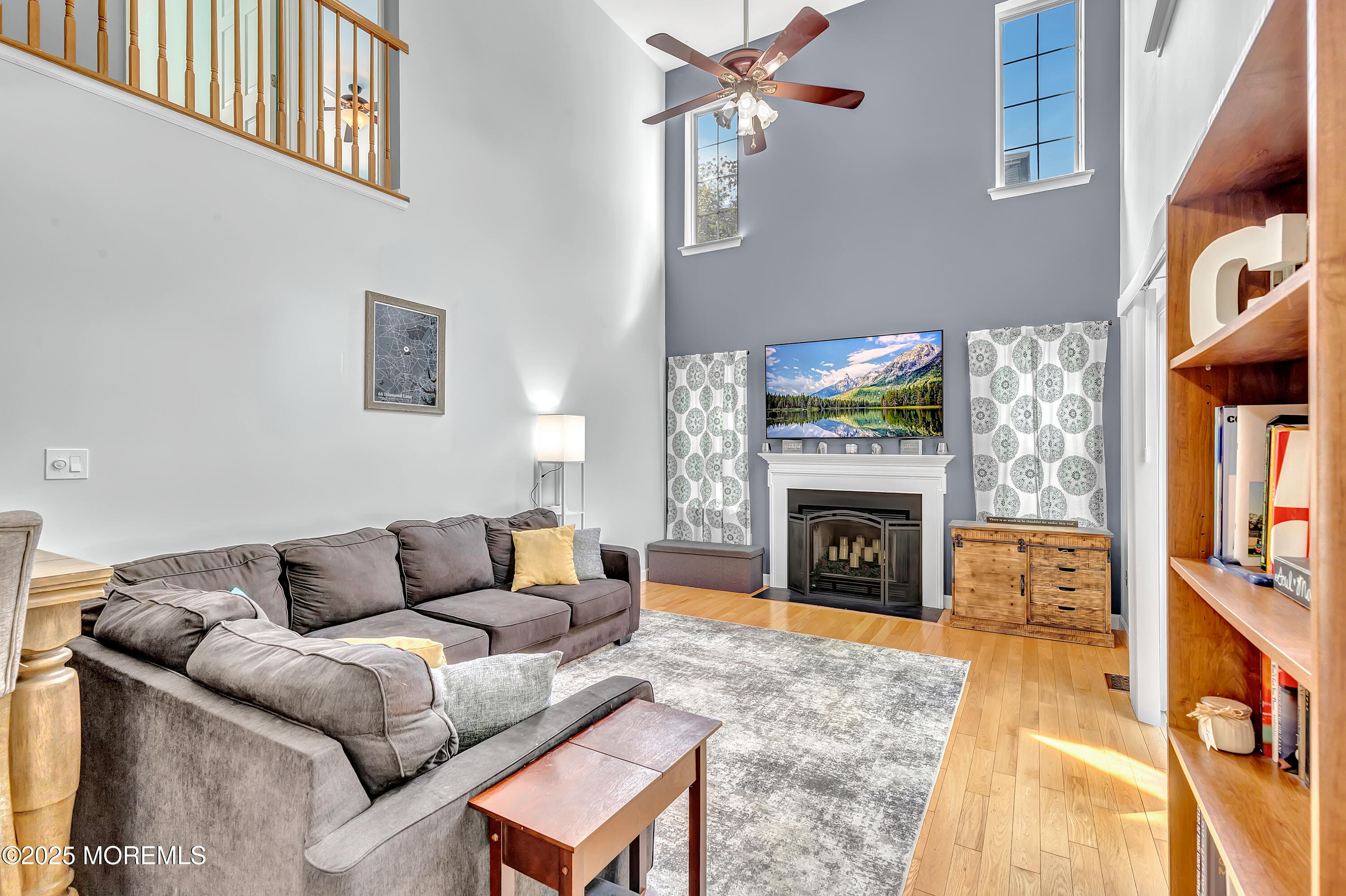 66 Diamond Lane Howell, NJ 07731 - Photo 6 of 47 a living room with furniture and a fireplace
