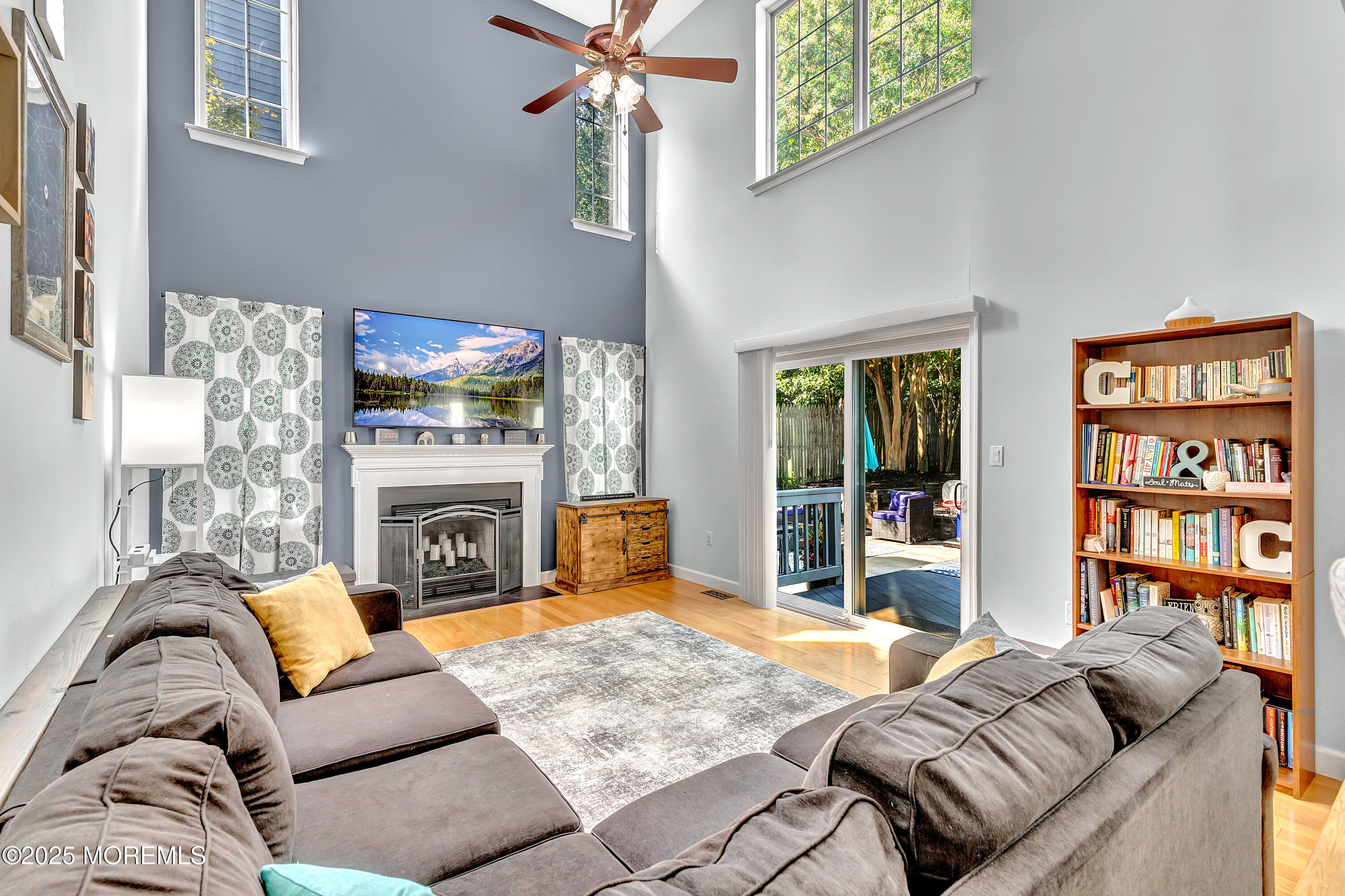 66 Diamond Lane Howell, NJ 07731 - Photo 9 of 47 a living room with furniture and a fireplace
