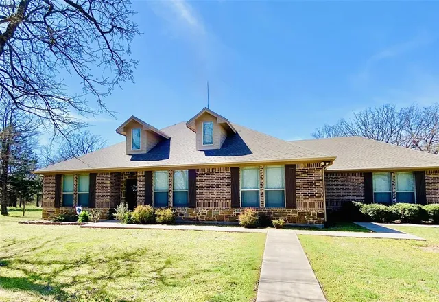a front view of a house with swimming pool