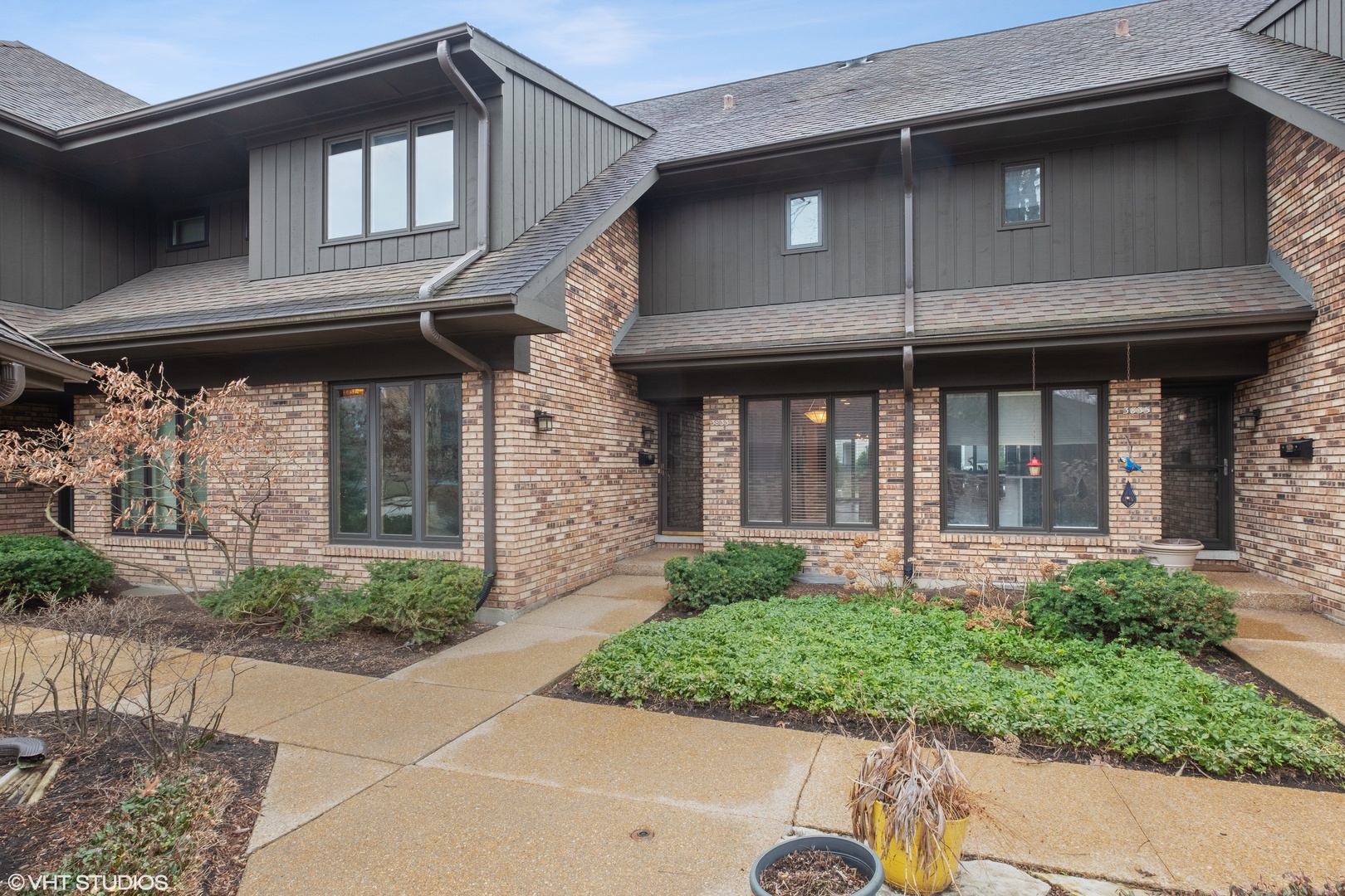 a front view of a house with garden