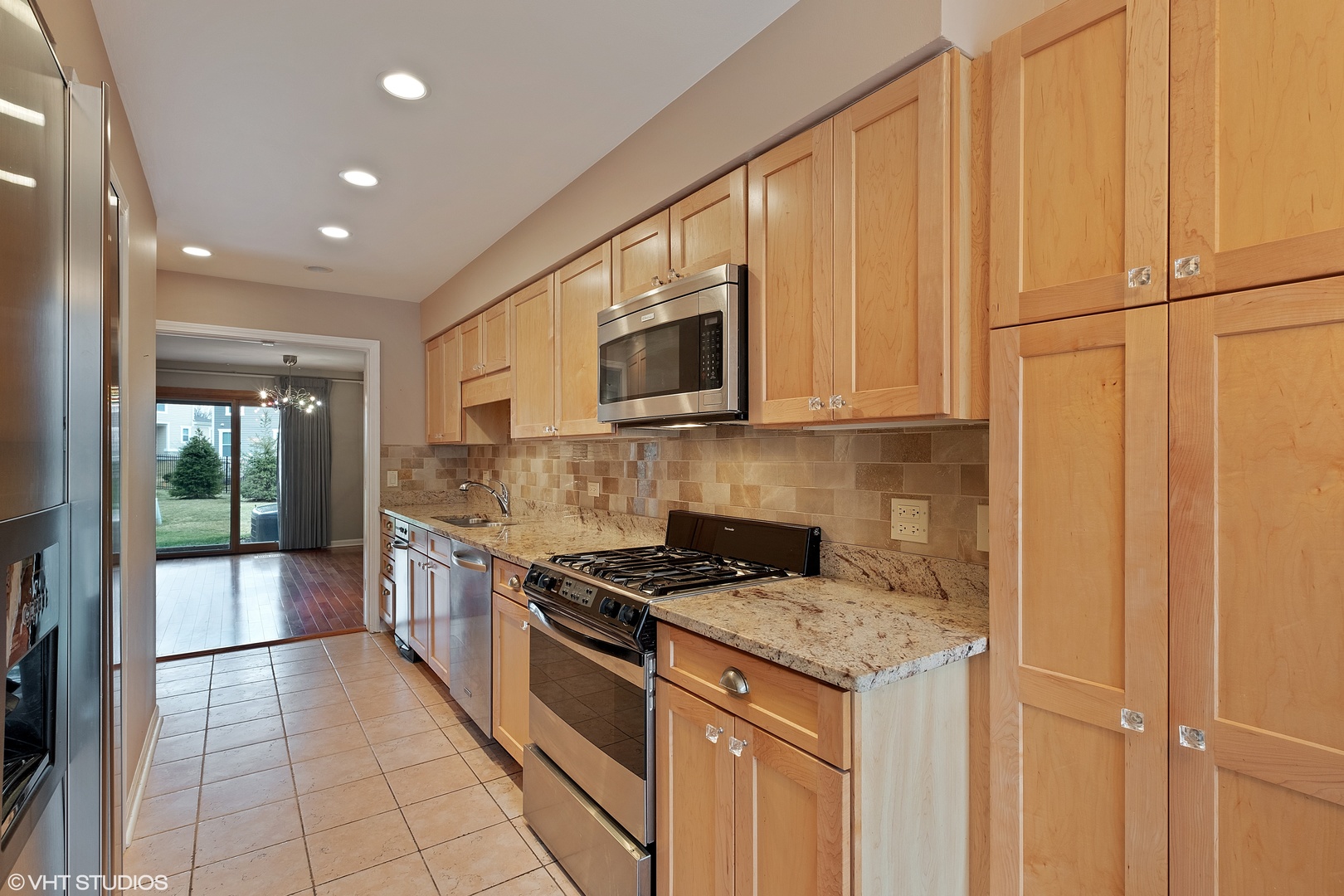 3833 Mission Hills Road, Unit 2B Northbrook, IL 60062 - Photo 2 of 24 a kitchen with granite countertop a sink a stove and cabinets