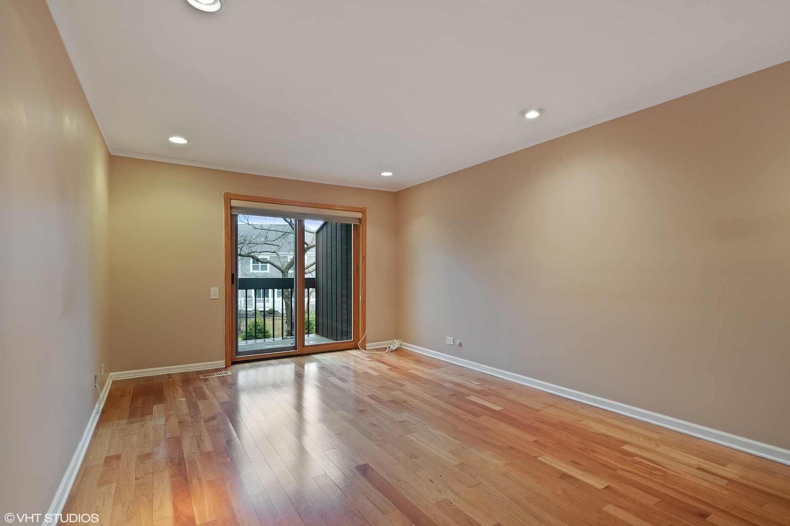 3833 Mission Hills Road, Unit 2B Northbrook, IL 60062 - Photo 11 of 24 a view of an empty room with wooden floor and a window