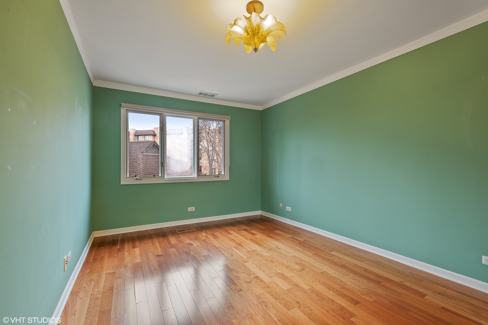 3833 Mission Hills Road, Unit 2B Northbrook, IL 60062 - Photo 13 of 24 a view of empty room with window and wooden floor