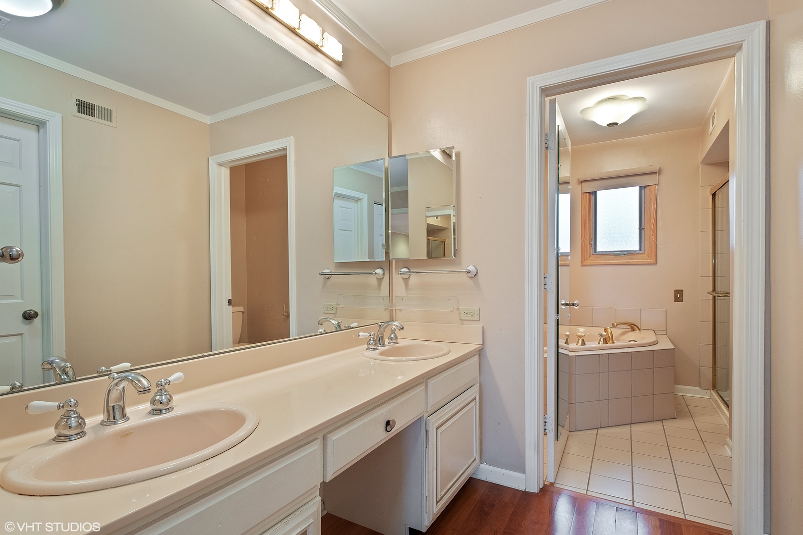 3833 Mission Hills Road, Unit 2B Northbrook, IL 60062 - Photo 15 of 24 a bathroom with a sink a light fixture a vanity and a mirror