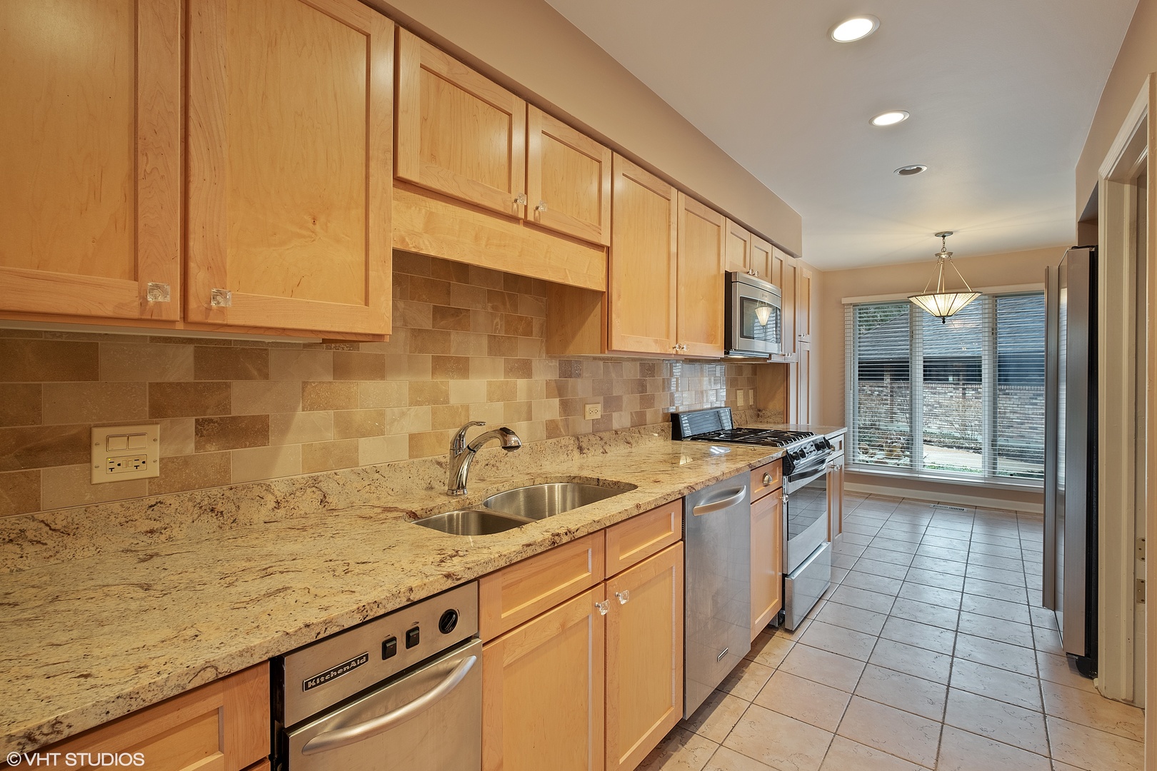 3833 Mission Hills Road, Unit 2B Northbrook, IL 60062 - Photo 3 of 24 a kitchen with a sink and cabinets
