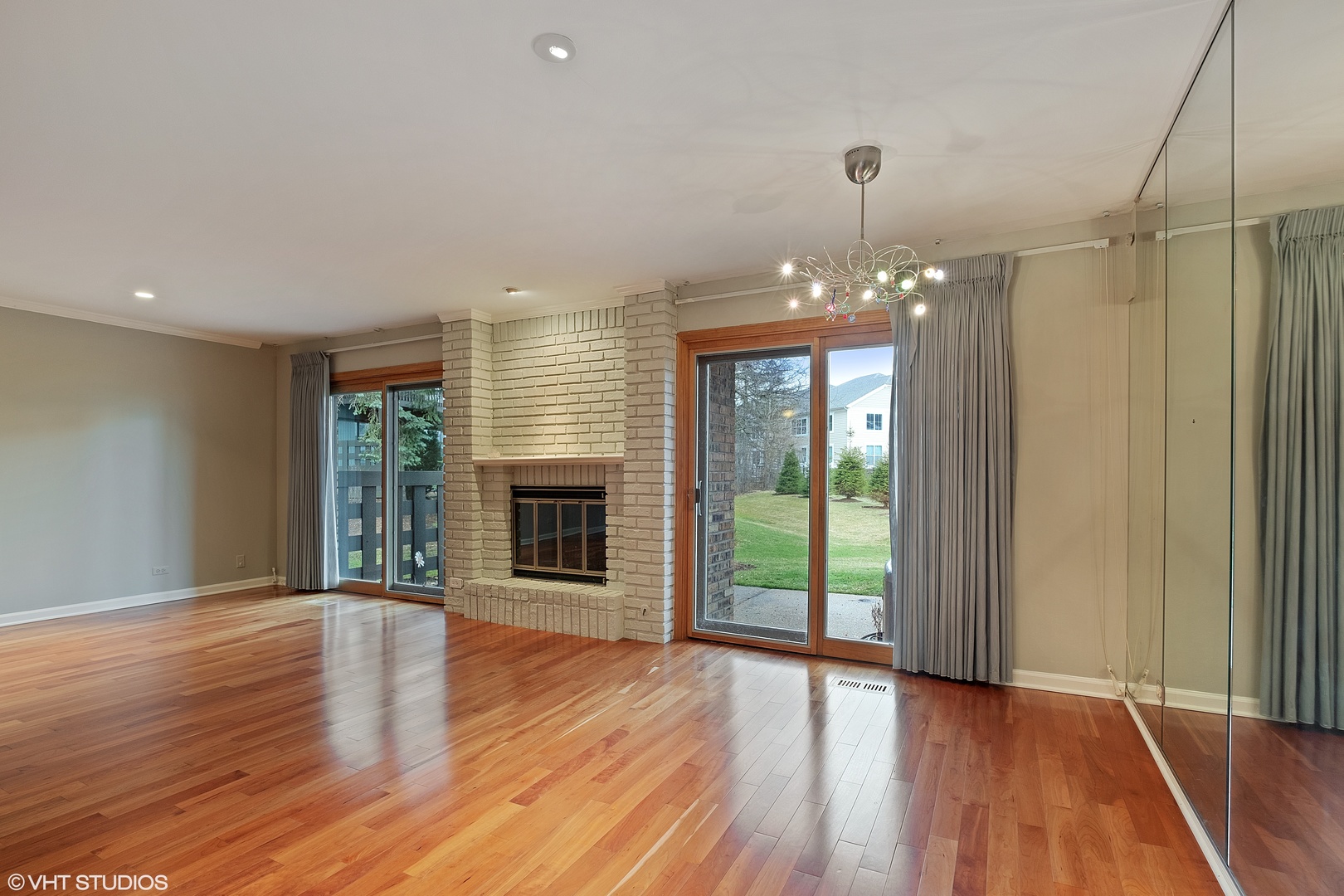 3833 Mission Hills Road, Unit 2B Northbrook, IL 60062 - Photo 8 of 24 a view of a livingroom with wooden floor fireplace and a window