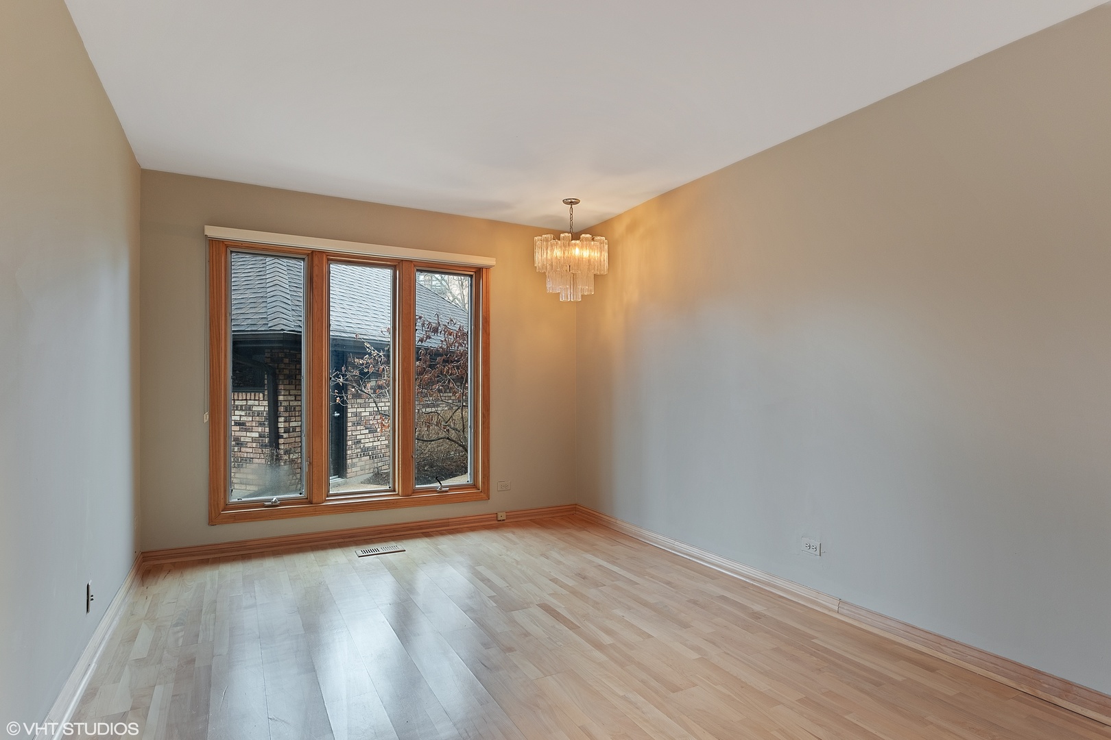 3833 Mission Hills Road, Unit 2B Northbrook, IL 60062 - Photo 9 of 24 wooden floor and window in an empty room