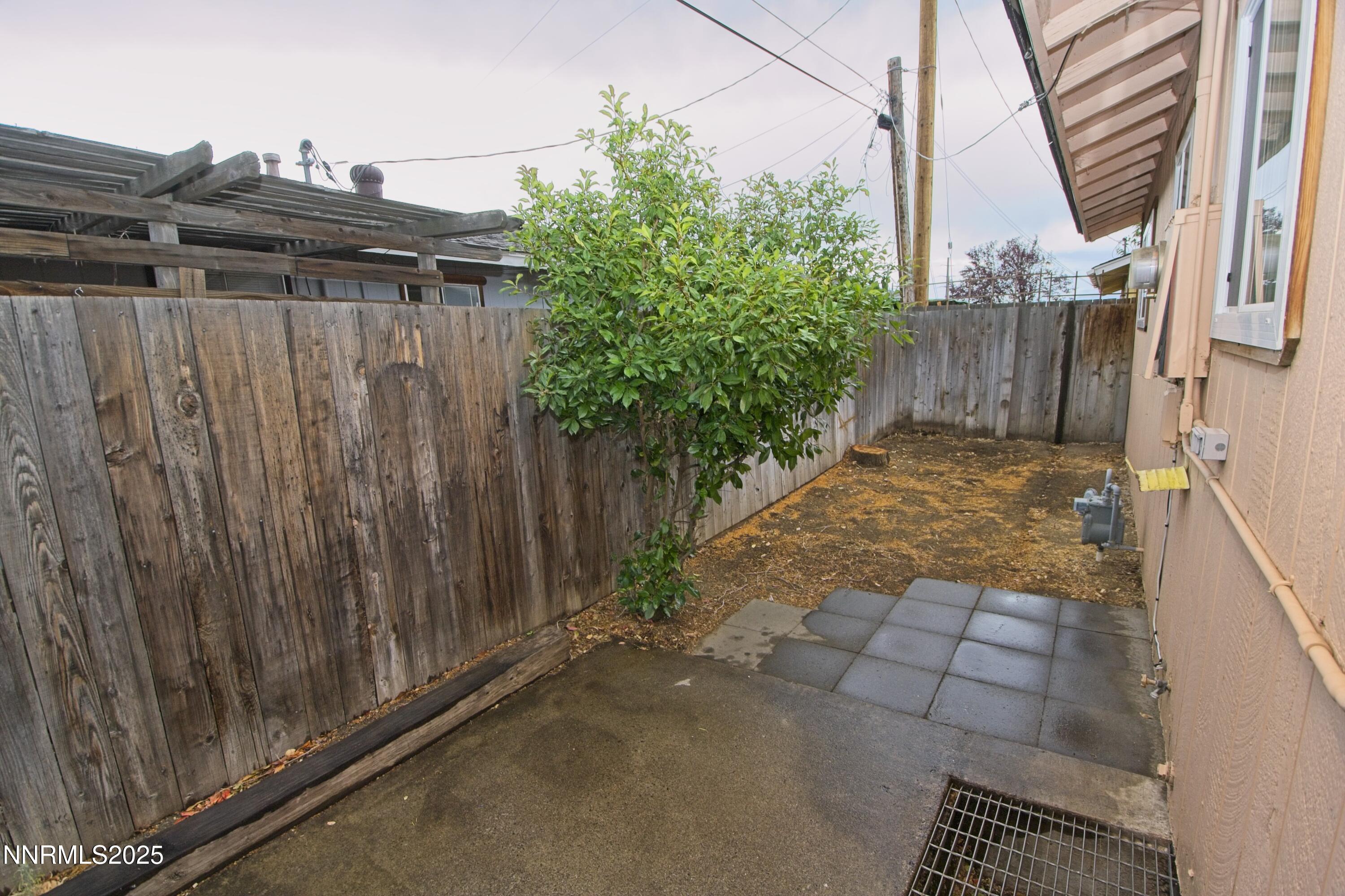 1600 East Long Street Carson City, NV 89706 - Photo 12 of 13 a view of outdoor space with wooden fence