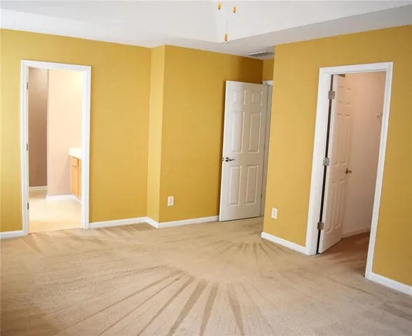 a view of a big room with closet and wooden floor