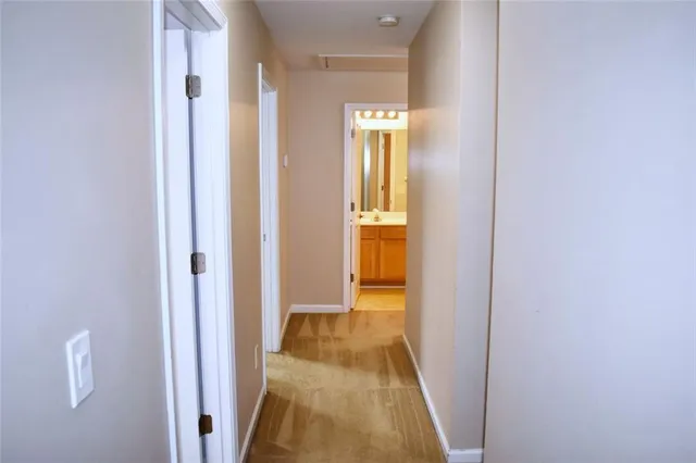 a view of a bathroom from the hallway