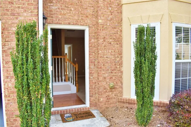 a view of a brick house with a large windows