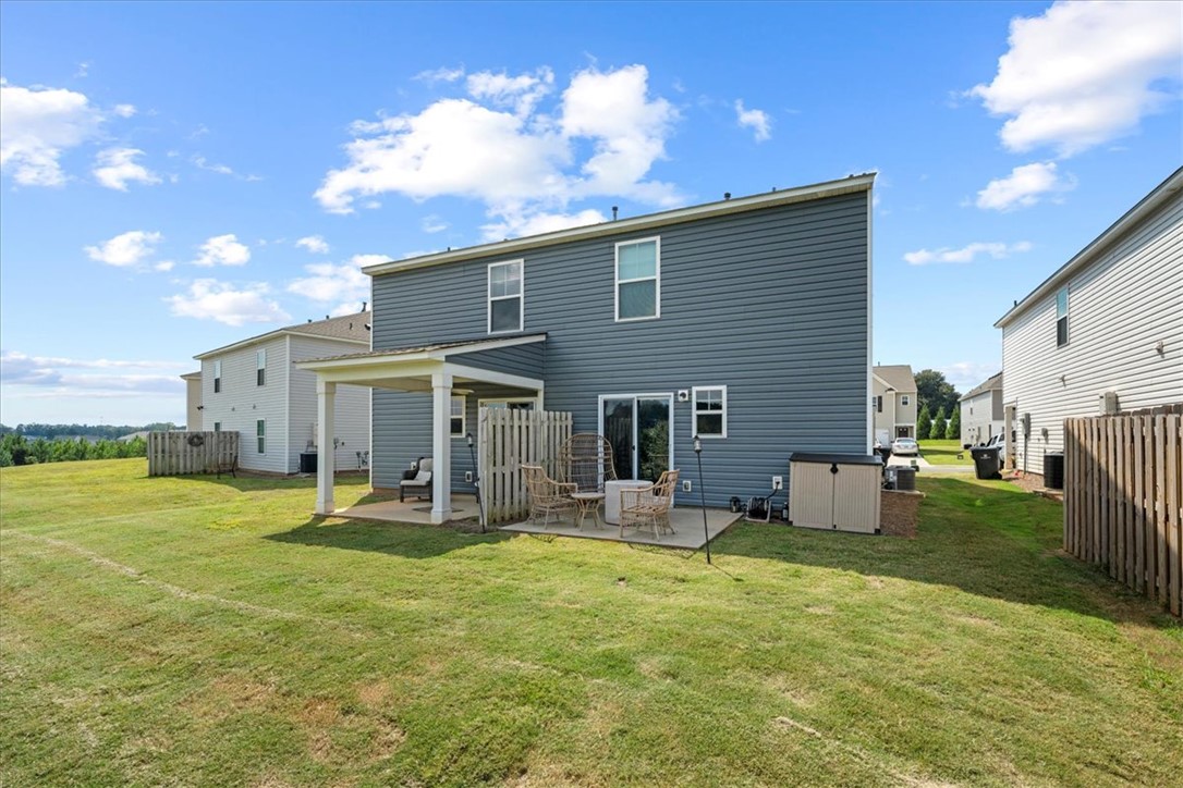 117 Adger Road Pendleton, SC 29670 - Photo 29 of 36 This residence features a patio and a vast grassy area for outdoor activities.