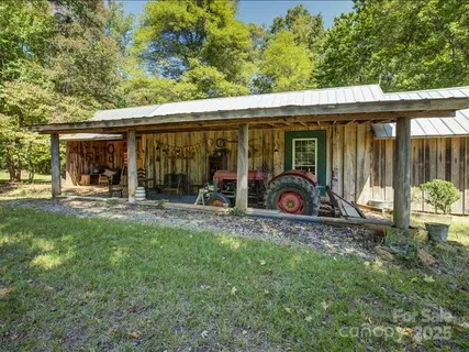 a view of a car park in front of a house