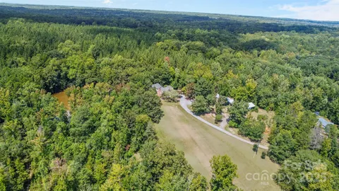 a view of a large yard with lots of green space