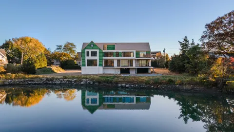 a house view with a lake view