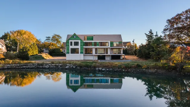a house view with a lake view