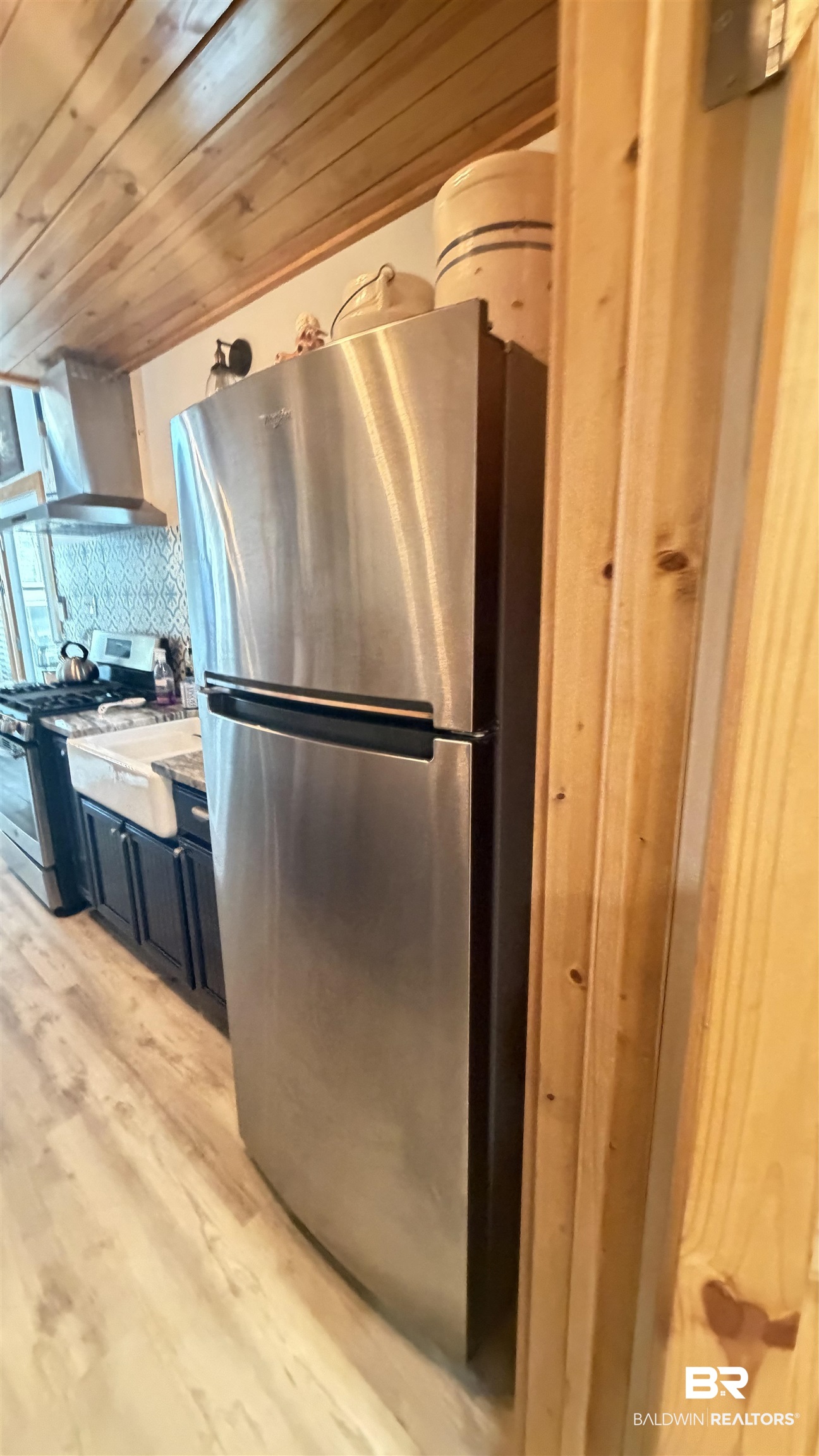 3983 Eureka Landing Road Uriah, AL 36480 - Photo 12 of 45 Kitchen with stainless steel appliances, wooden ceiling, light wood-style floors, and decorative backsplash