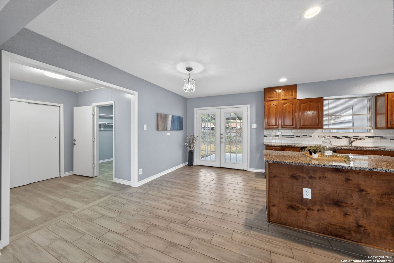 4531 Eisenhauer Road San Antonio, TX 78218 - Photo 15 of 32 a view of kitchen with stainless steel appliances granite countertop a stove and a refrigerator