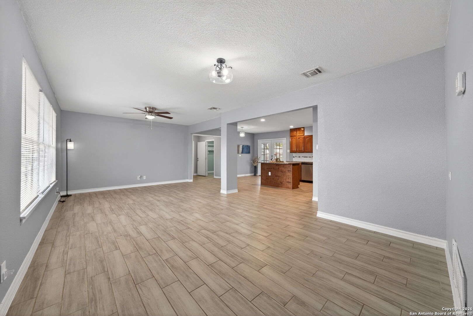 4531 Eisenhauer Road San Antonio, TX 78218 - Photo 18 of 32 a view of empty room with wooden floor and window
