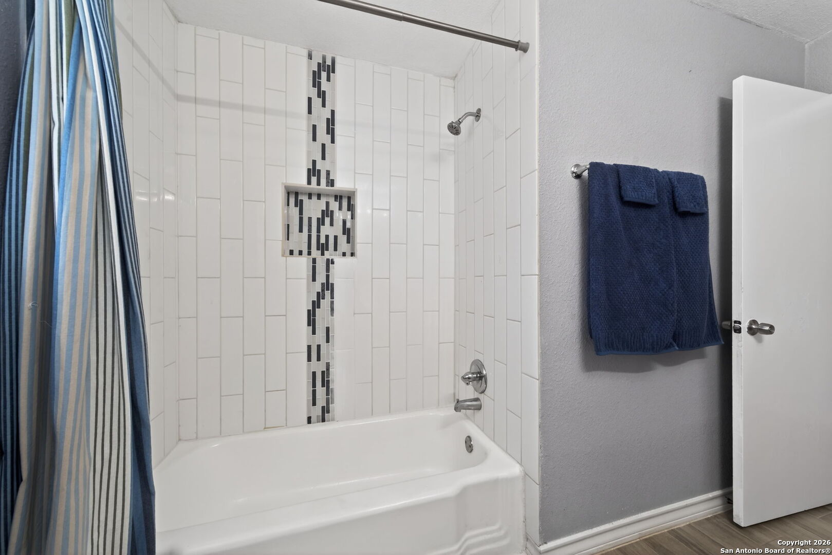 4531 Eisenhauer Road San Antonio, TX 78218 - Photo 23 of 32 a bathroom with a bathtub and shower