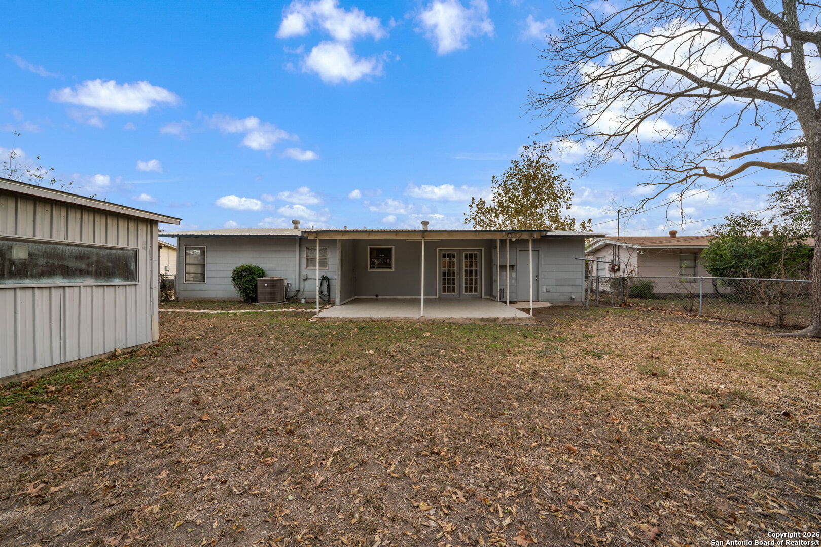 4531 Eisenhauer Road San Antonio, TX 78218 - Photo 29 of 32 a view of a house with a yard and garage