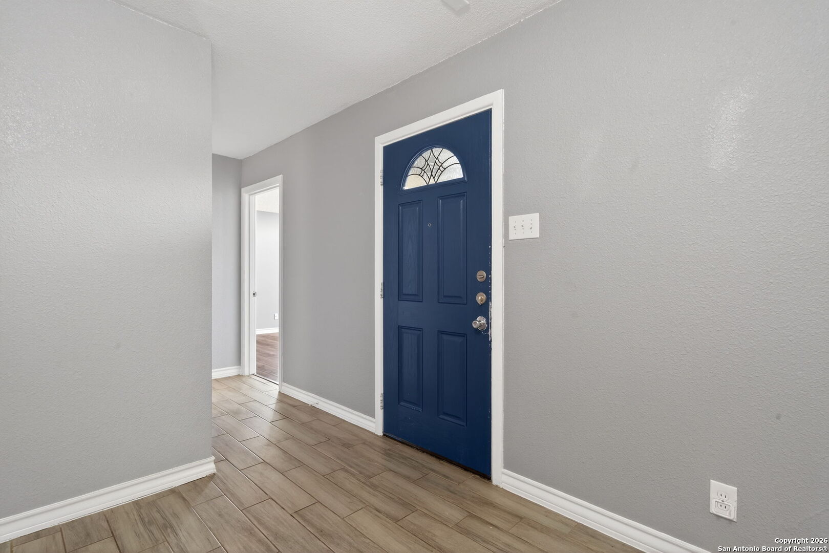 4531 Eisenhauer Road San Antonio, TX 78218 - Photo 5 of 32 a view of front door with wooden floor
