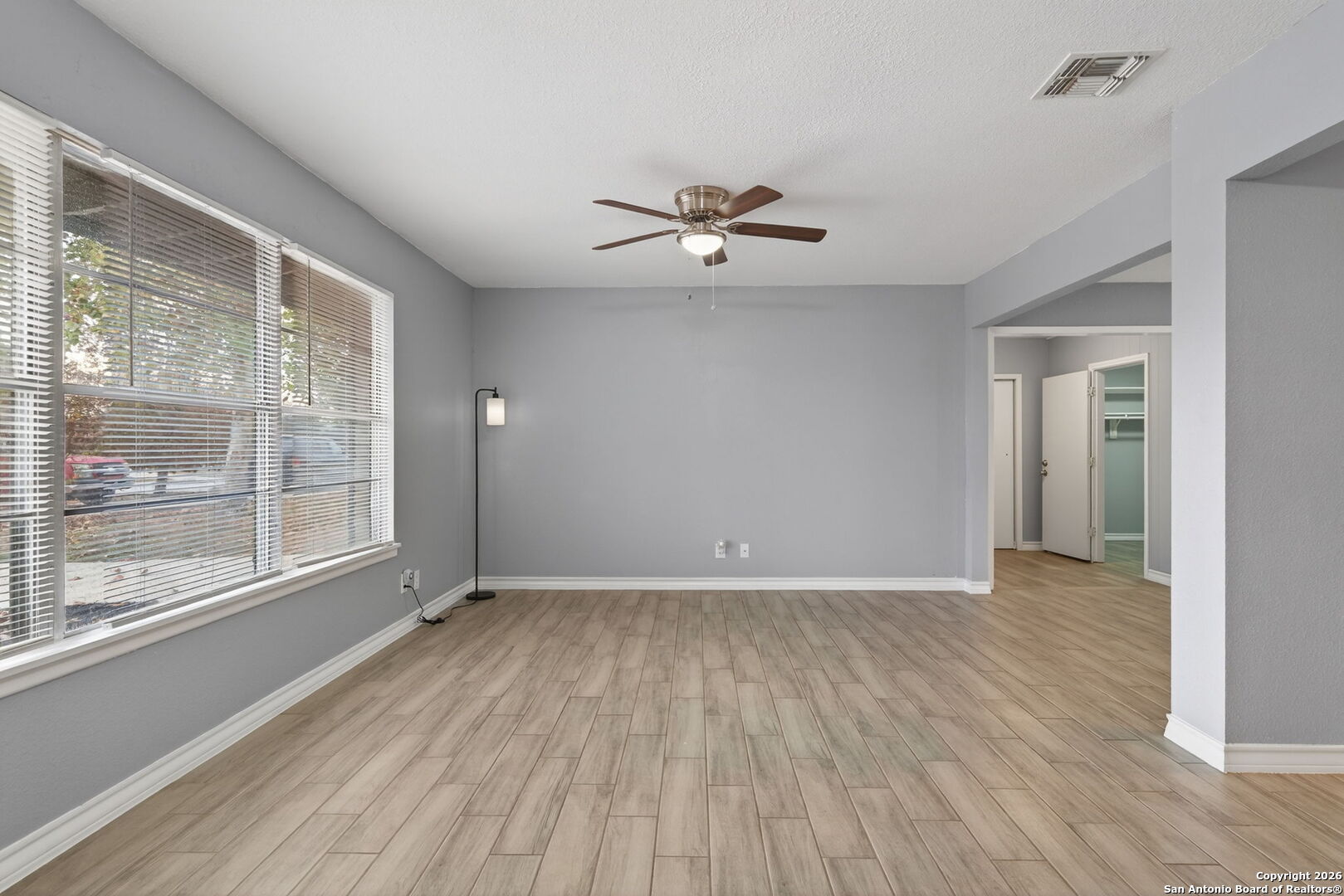 4531 Eisenhauer Road San Antonio, TX 78218 - Photo 7 of 32 a view of room with a ceiling fan and window