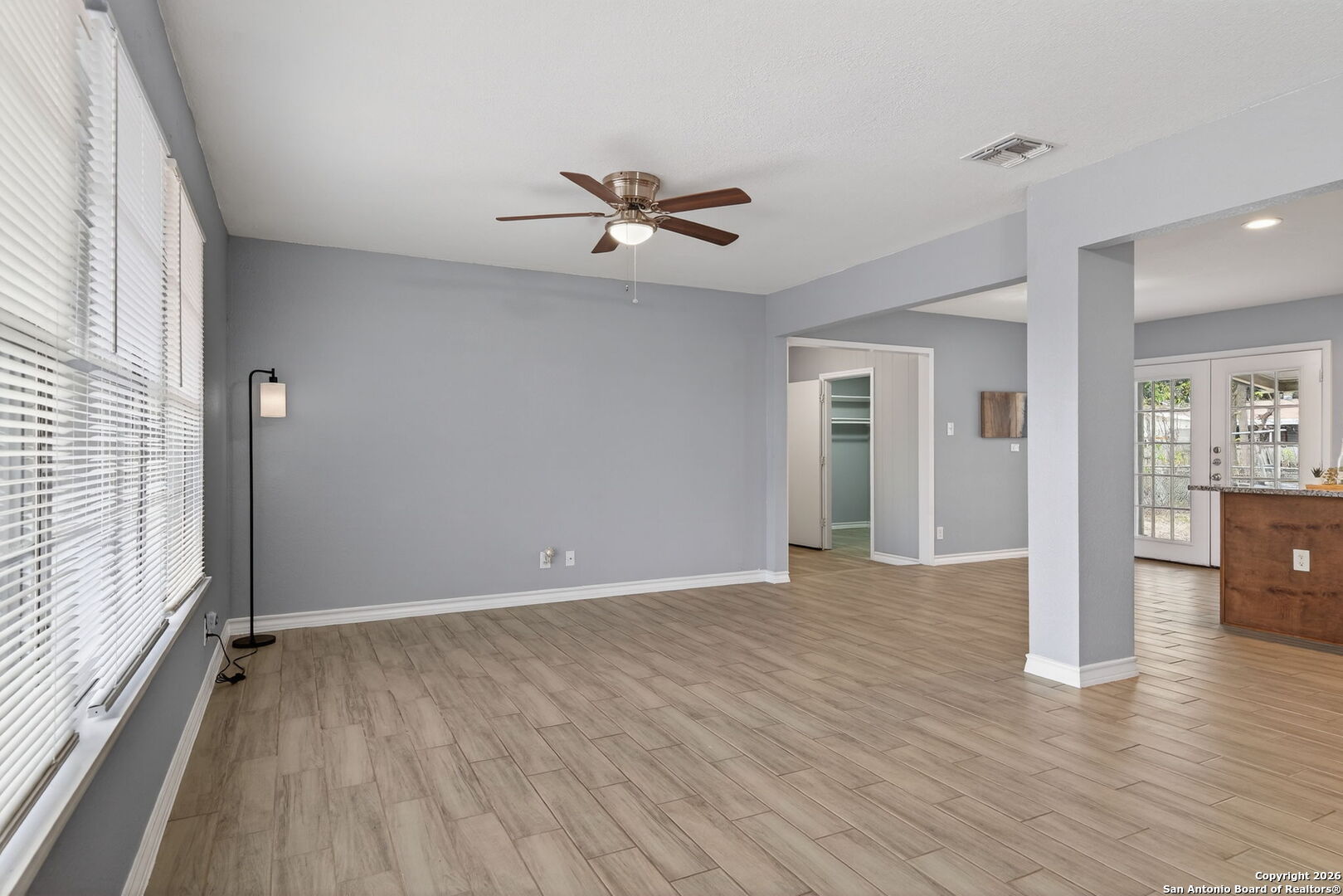 4531 Eisenhauer Road San Antonio, TX 78218 - Photo 8 of 32 wooden floor in an empty room with a window
