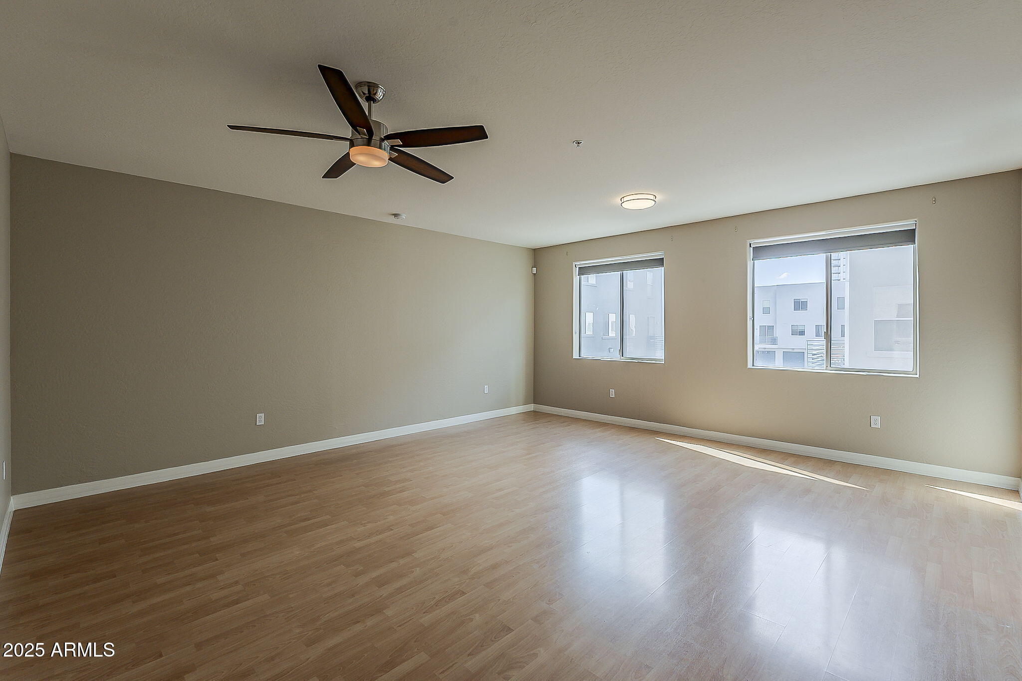 615 East Portland Street, Unit 277 Phoenix, AZ 85004 - Photo 9 of 39 a view of a livingroom with a ceiling fan and window
