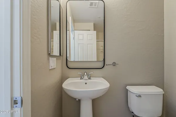 a kitchen with stainless steel appliances granite countertop a refrigerator a stove a sink and a microwave