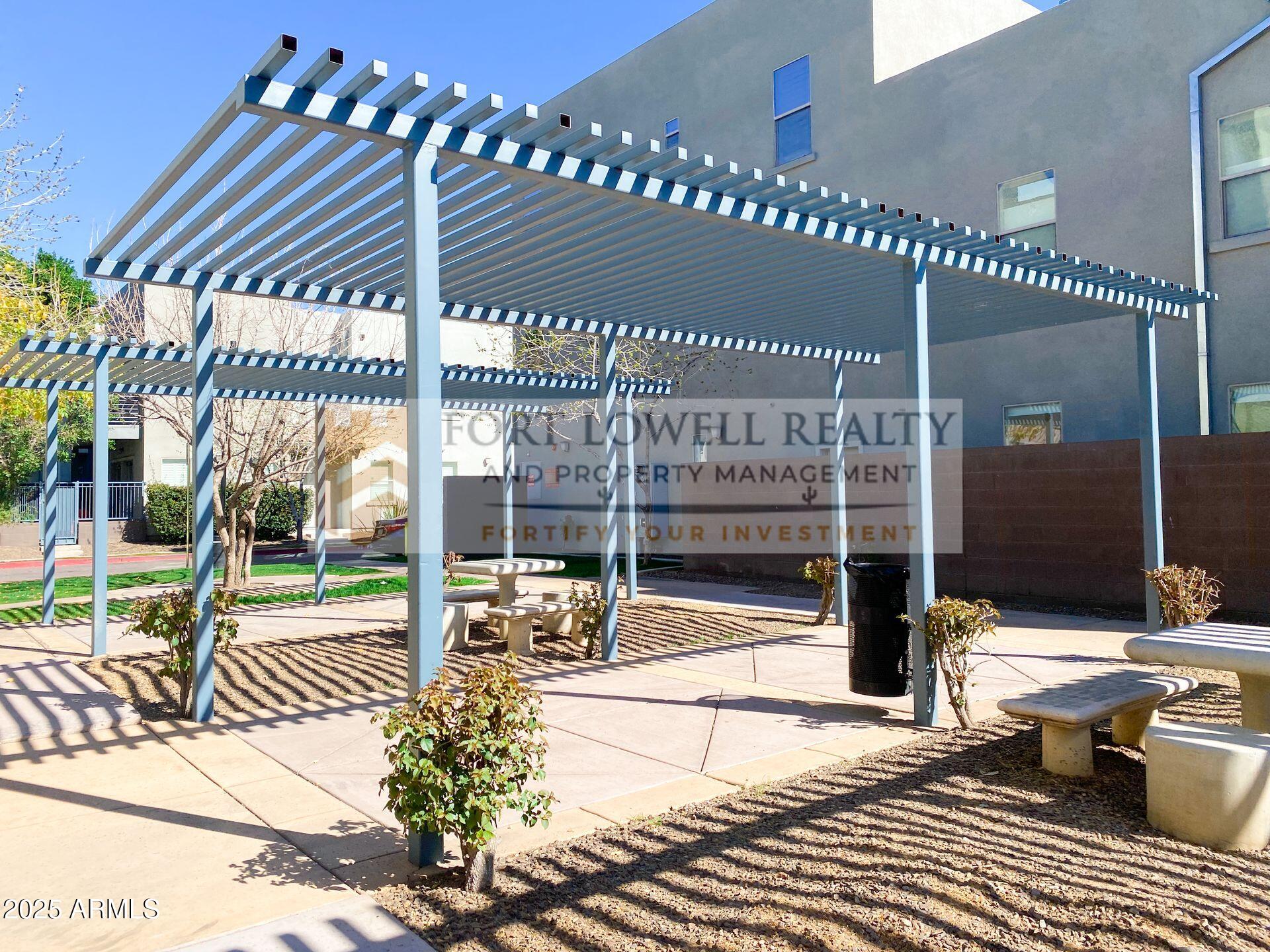 615 East Portland Street, Unit 277 Phoenix, AZ 85004 - Photo 33 of 39 a building outdoor space with patio furniture and potted plants