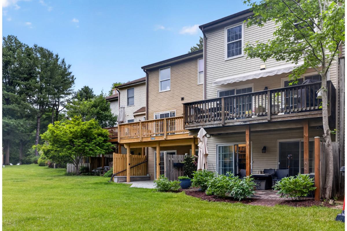 7347 Swan Point Way, Unit 122 Columbia, MD 21045 - Photo 43 of 54 a view of a house with a yard and potted plants