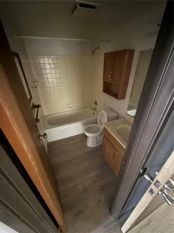 wooden floor in a white room