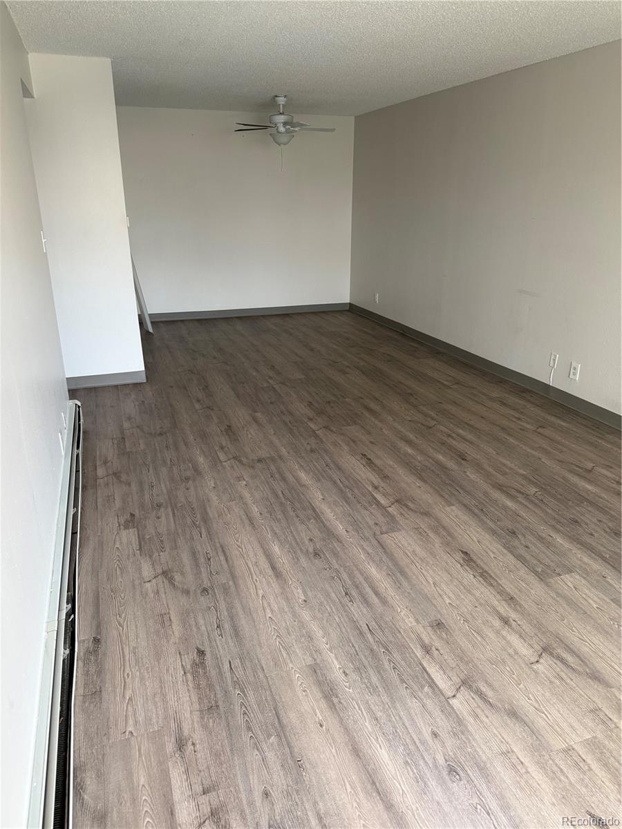 7780 West 38th Avenue, Unit 302 Wheat Ridge, CO 80033 - Photo 18 of 24 wooden floor in a white room