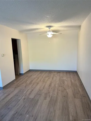 a view of room with wooden floor