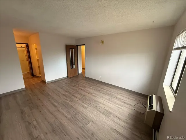 a bathroom with a sink a mirror and a shower