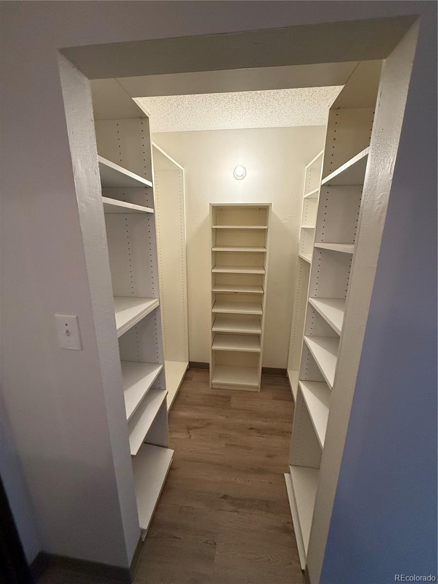 7780 West 38th Avenue, Unit 302 Wheat Ridge, CO 80033 - Photo 6 of 17 a view of walk in closet with empty racks