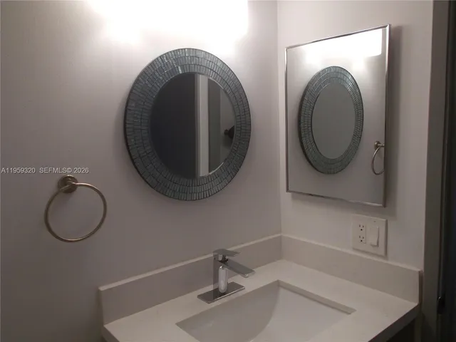 a white toilet sitting next to a window