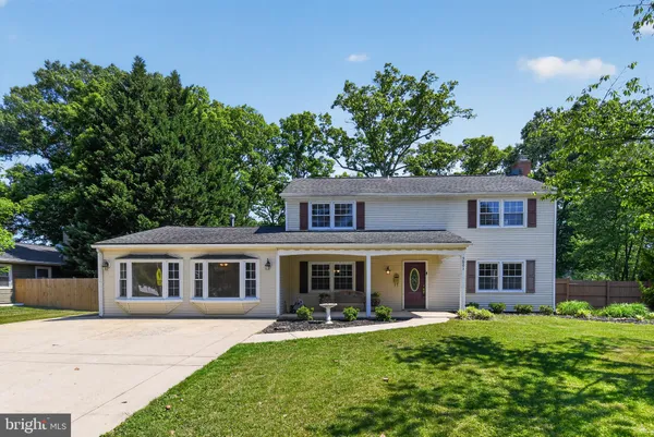 front view of a house with a garden