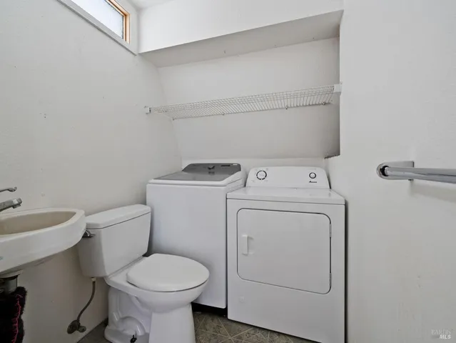 a view of bathroom with a washer and dryer