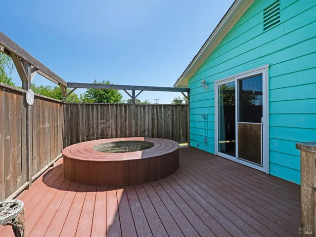 a view of outdoor sitting space with wooden deck