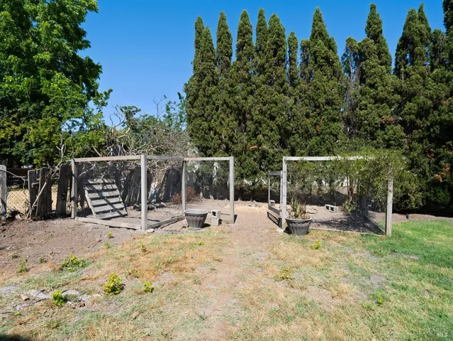 a view of a chair and tables in the patio