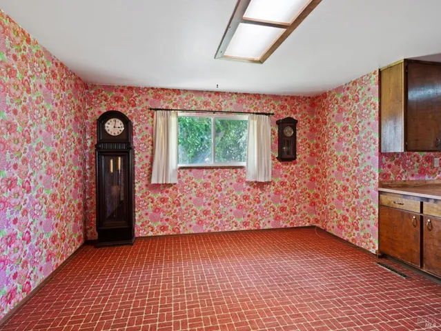 a view of an entryway door with wooden floor