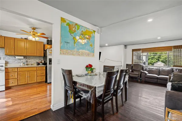 a view of kitchen with dining table and chairs