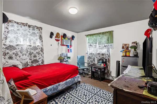 a bedroom with bed and a window
