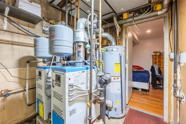 a utility room with multiple dryer and washer