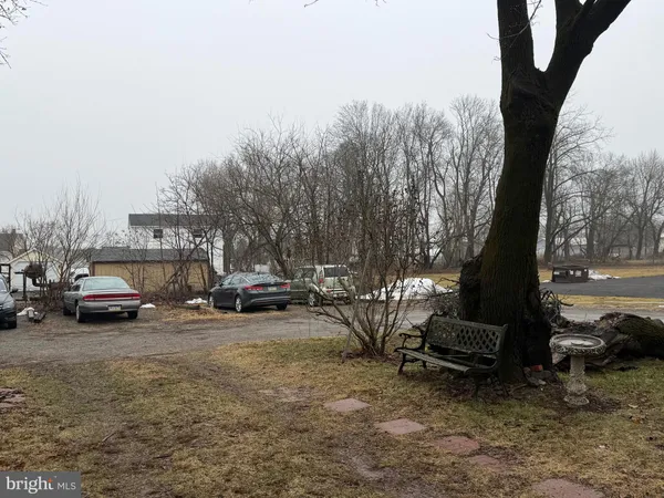 a view of street with parked cars